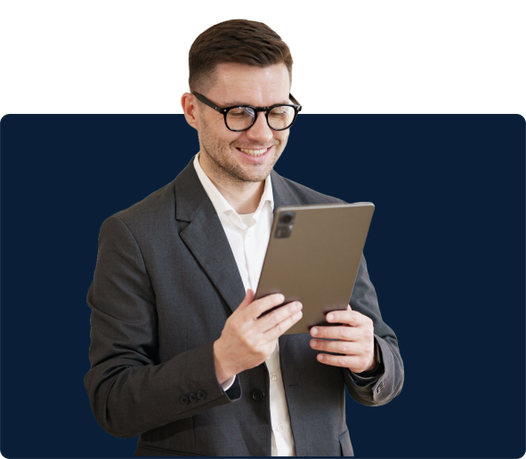 Confident male entrepreneur reviewing business project on tablet, smiling in satisfaction.